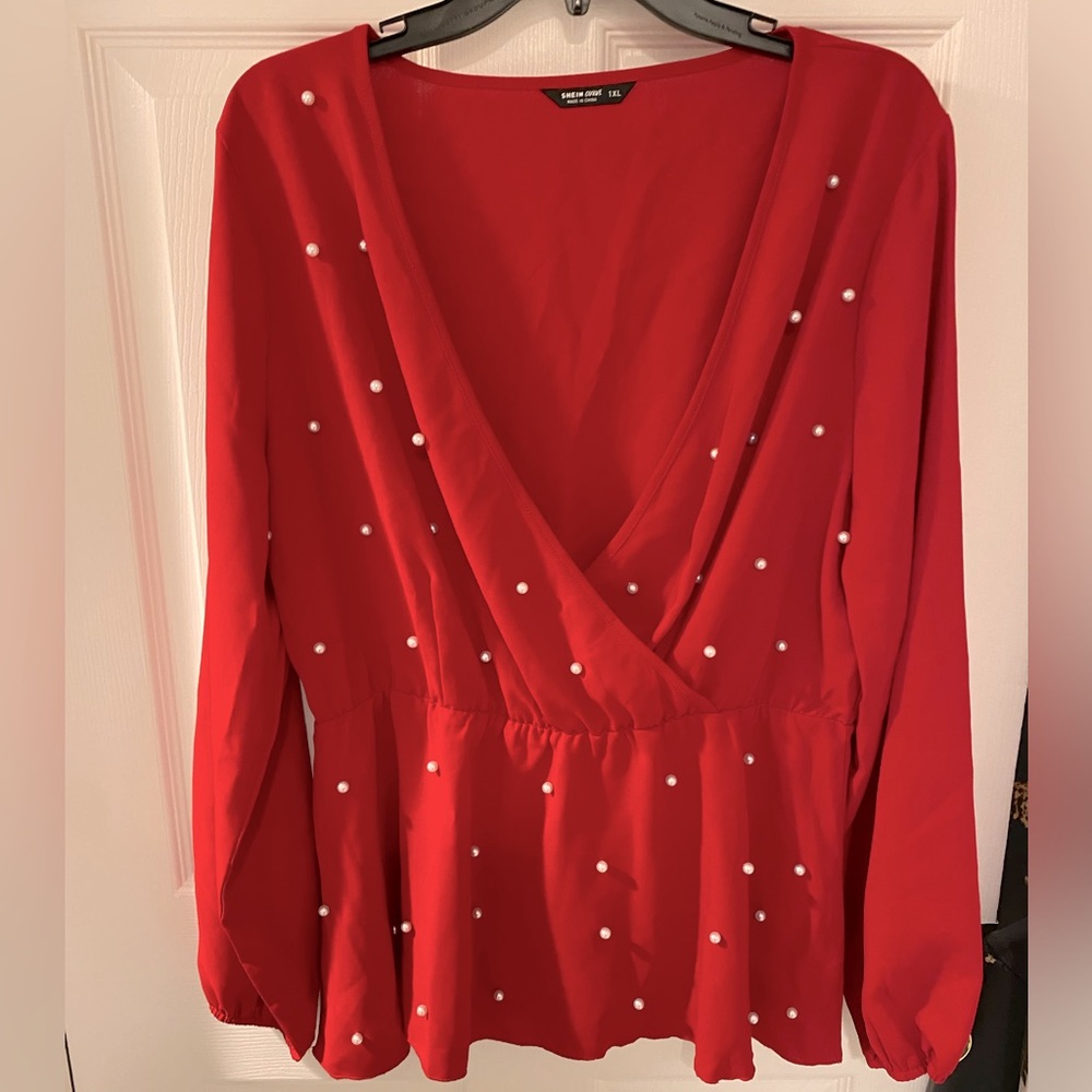 Pearl accent peplum top!